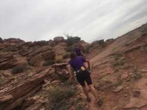 Jess running near canyon ridge