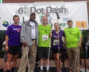 Photo of Jessica Beecham, Kevan Worley, Brandon Stepanowich, Anil Lewis, & NFB President Mark Riccobono at the 2016 6 Dot Dash